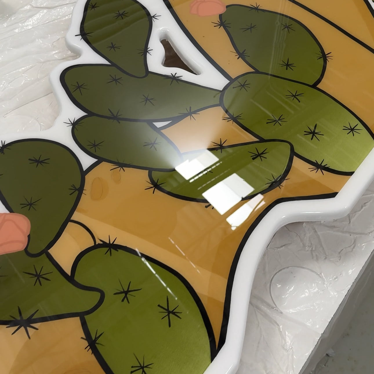 Artwork titled 'Prickly' featuring sharp lines and contrasting colors to depict a desert-inspired theme by St. Jame.